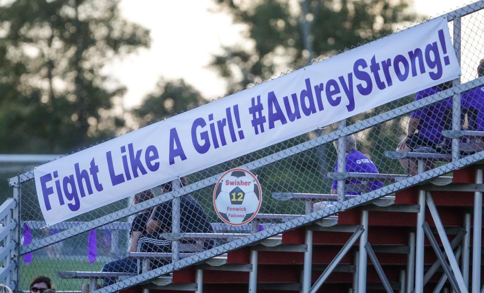 banner with purple writing
